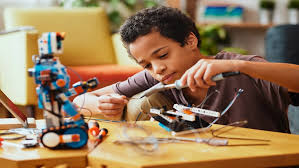 Kids building a robotics project in a workshop